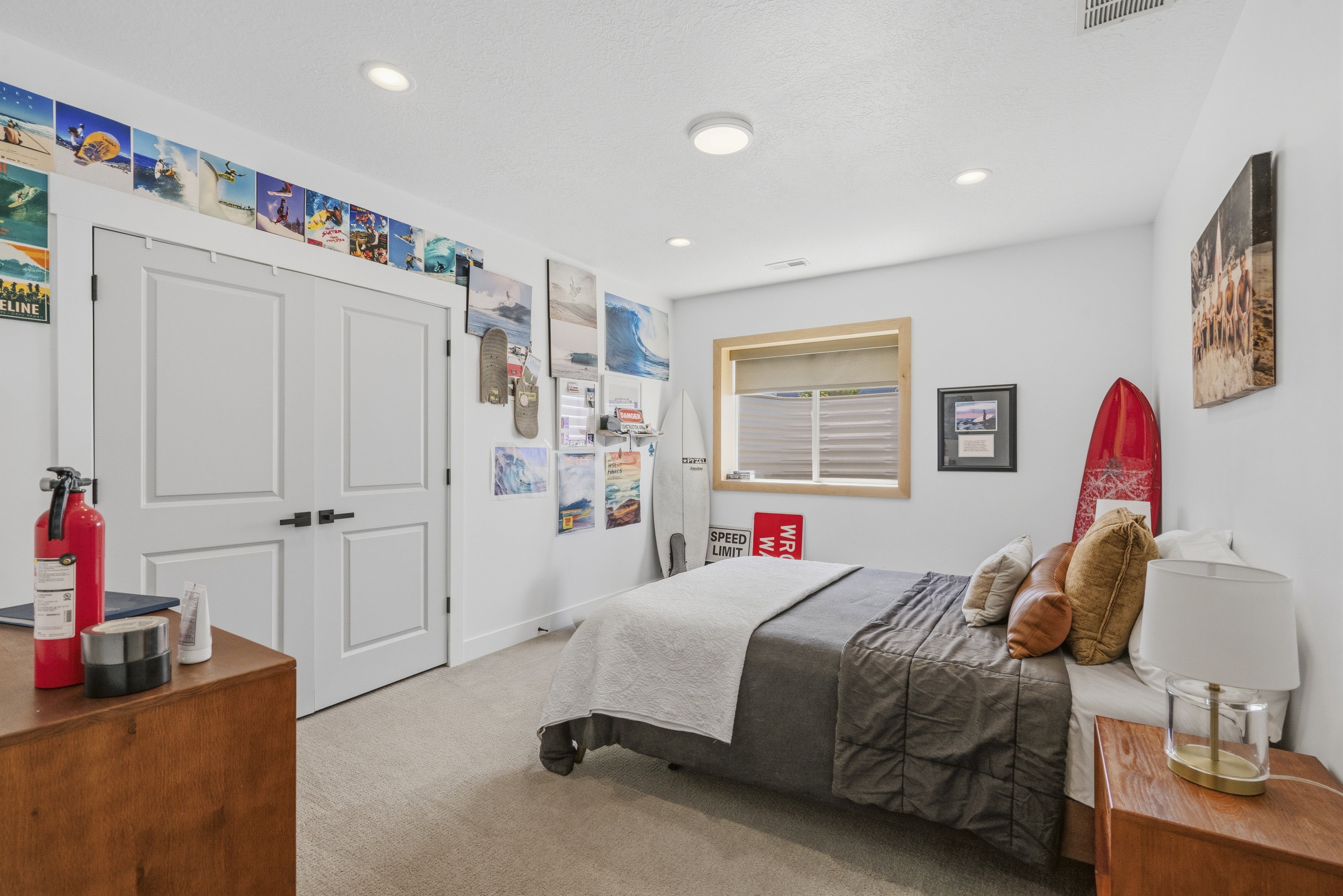 Bedroom featuring neutral wall paint, recessed lighting, double closet doors with matte black hardware, a wood-framed window with blinds, and carpet flooring