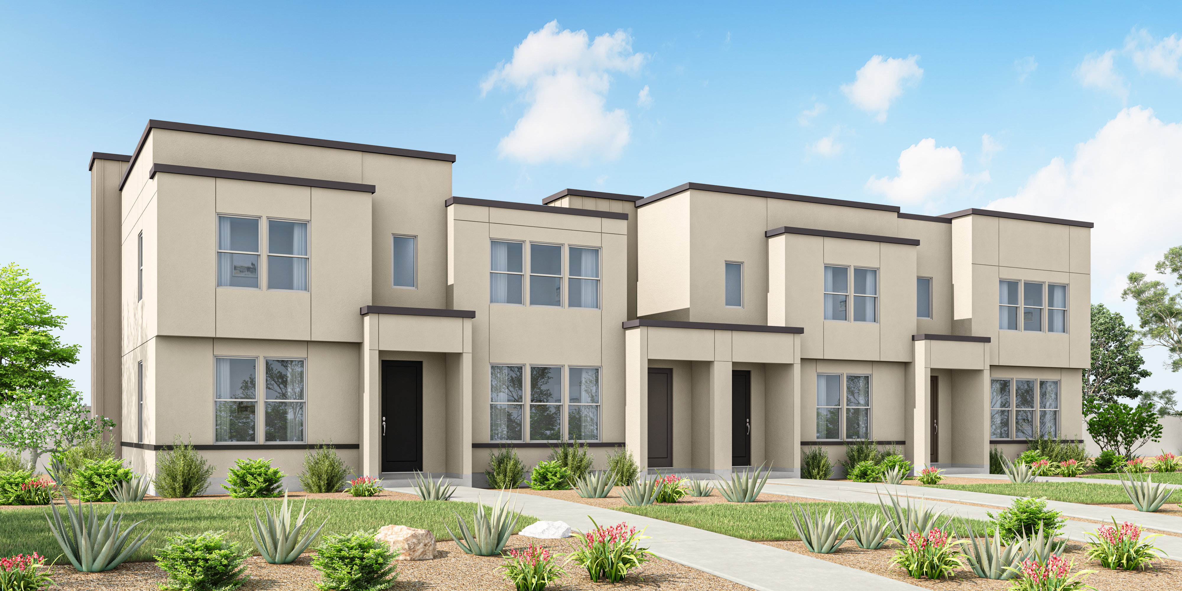Modern townhome exterior featuring a neutral stucco finish, dark trim accents, multiple windows, and a black entry door