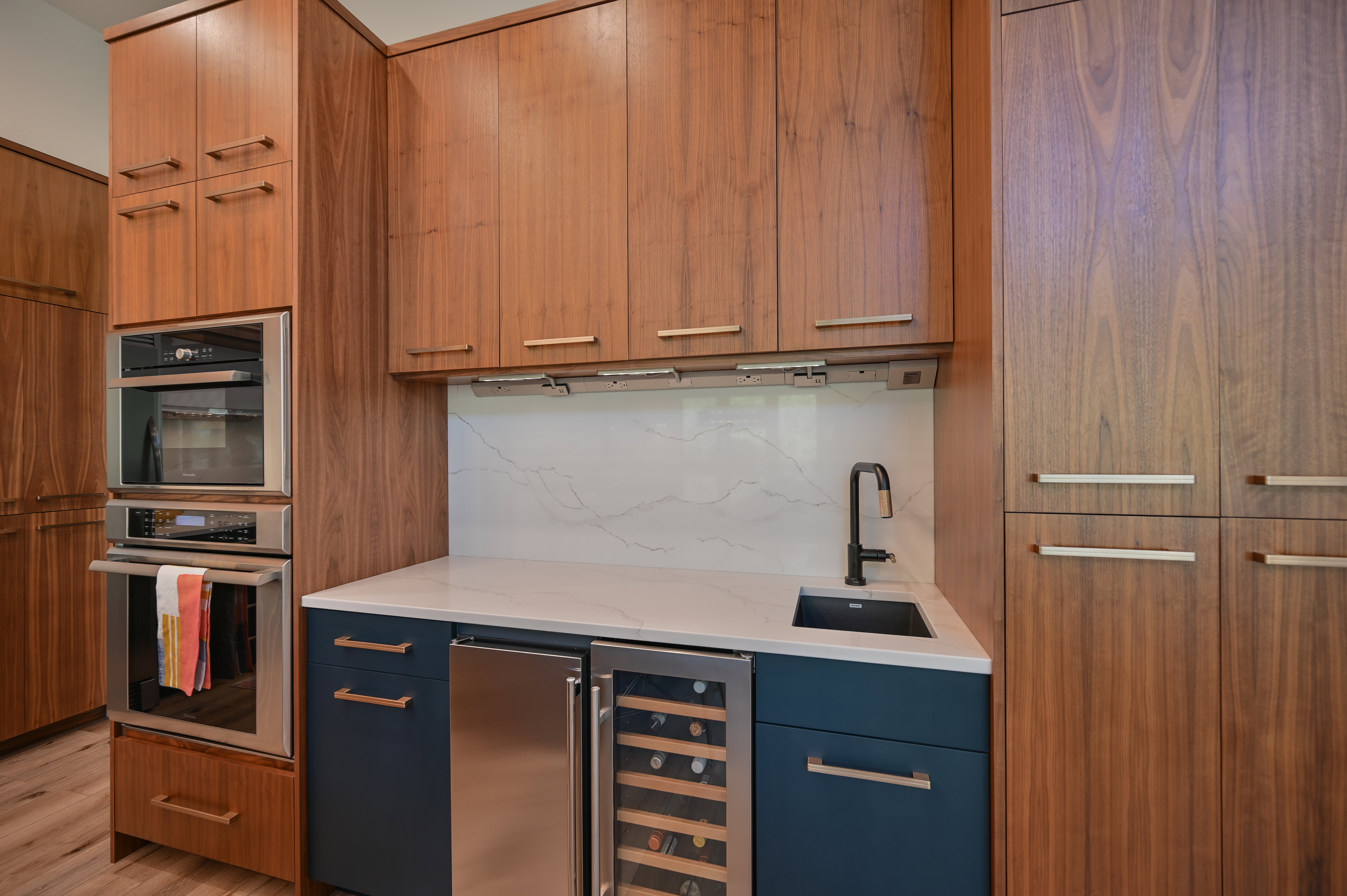 Built-in stainless steel appliances, including a double oven and beverage refrigerator