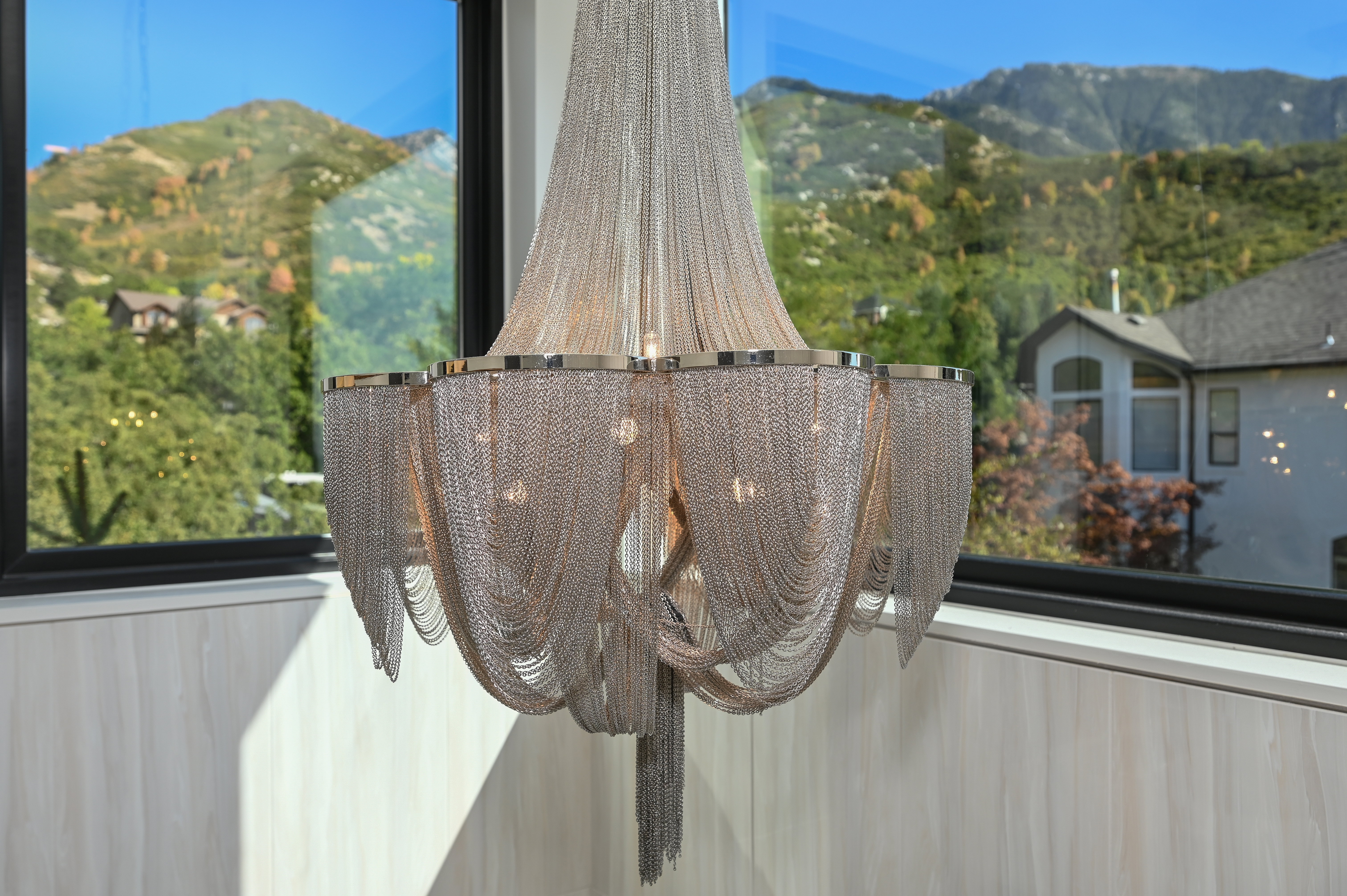 Ornate chainmail chandelier with polished chrome accents