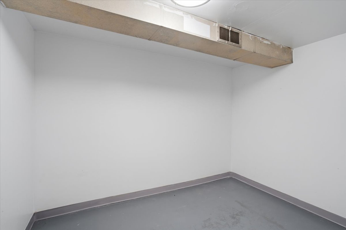 White-painted walls with gray baseboards and a gray floor