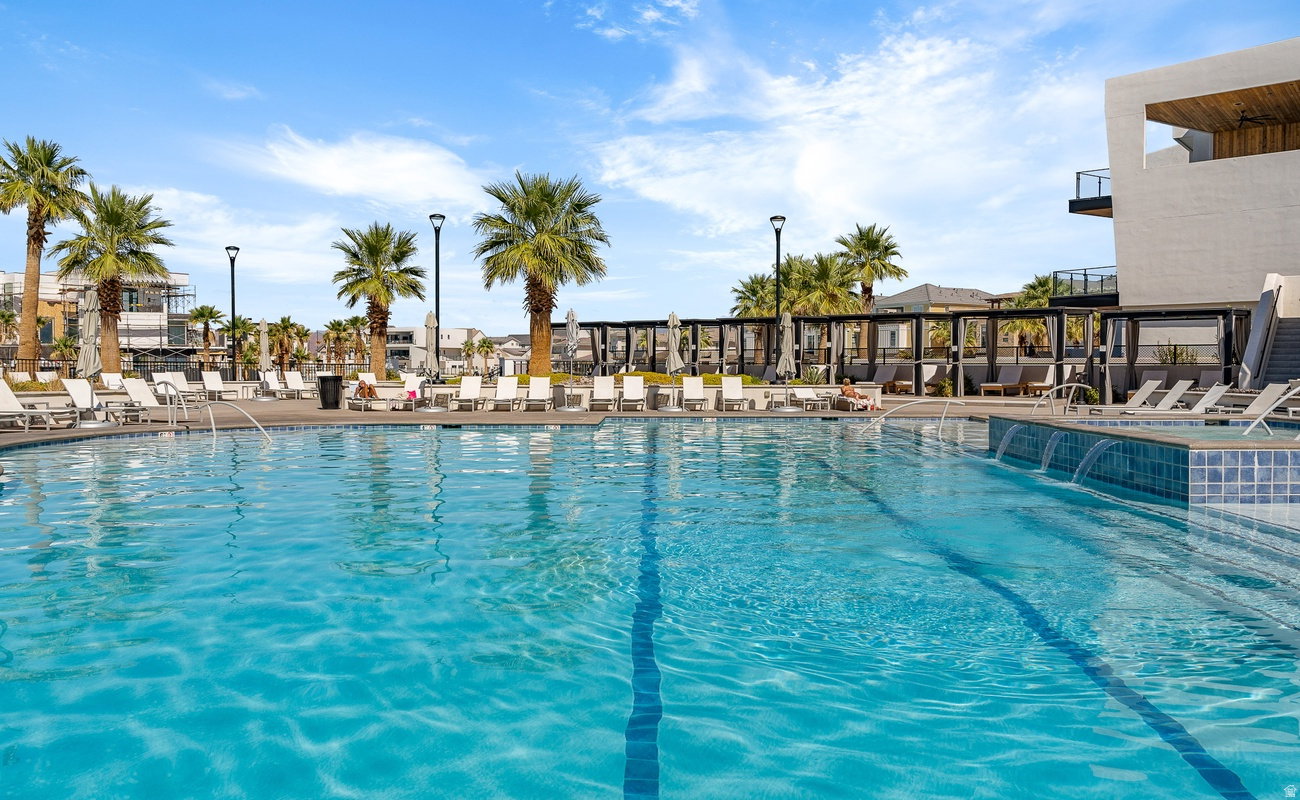 Expansive community swimming pool with integrated water features
