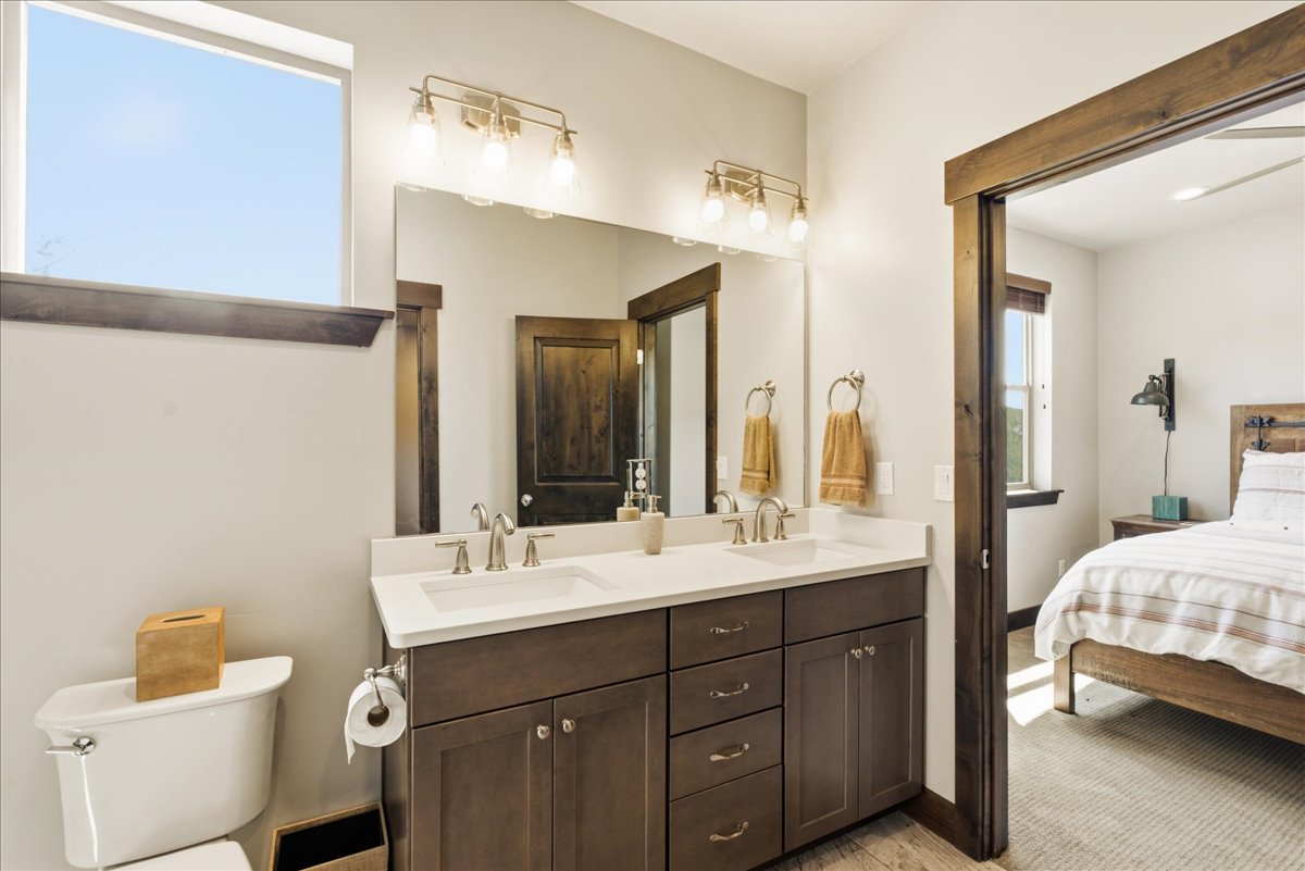 Double vanity with undermount sinks and light-toned countertops
