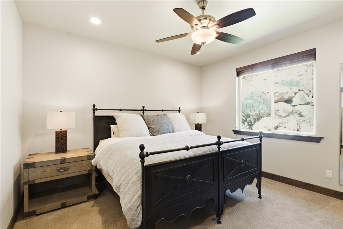 Recessed ceiling lighting, ceiling fan, and window with wood-finish trim