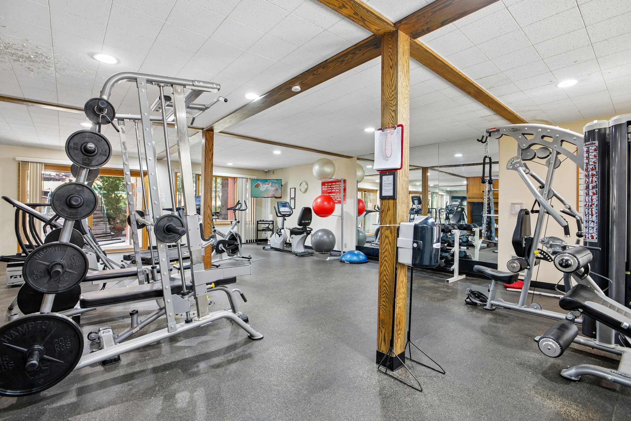 Fitness center featuring a weight rack, exercise bikes, and multi-station gym equipment