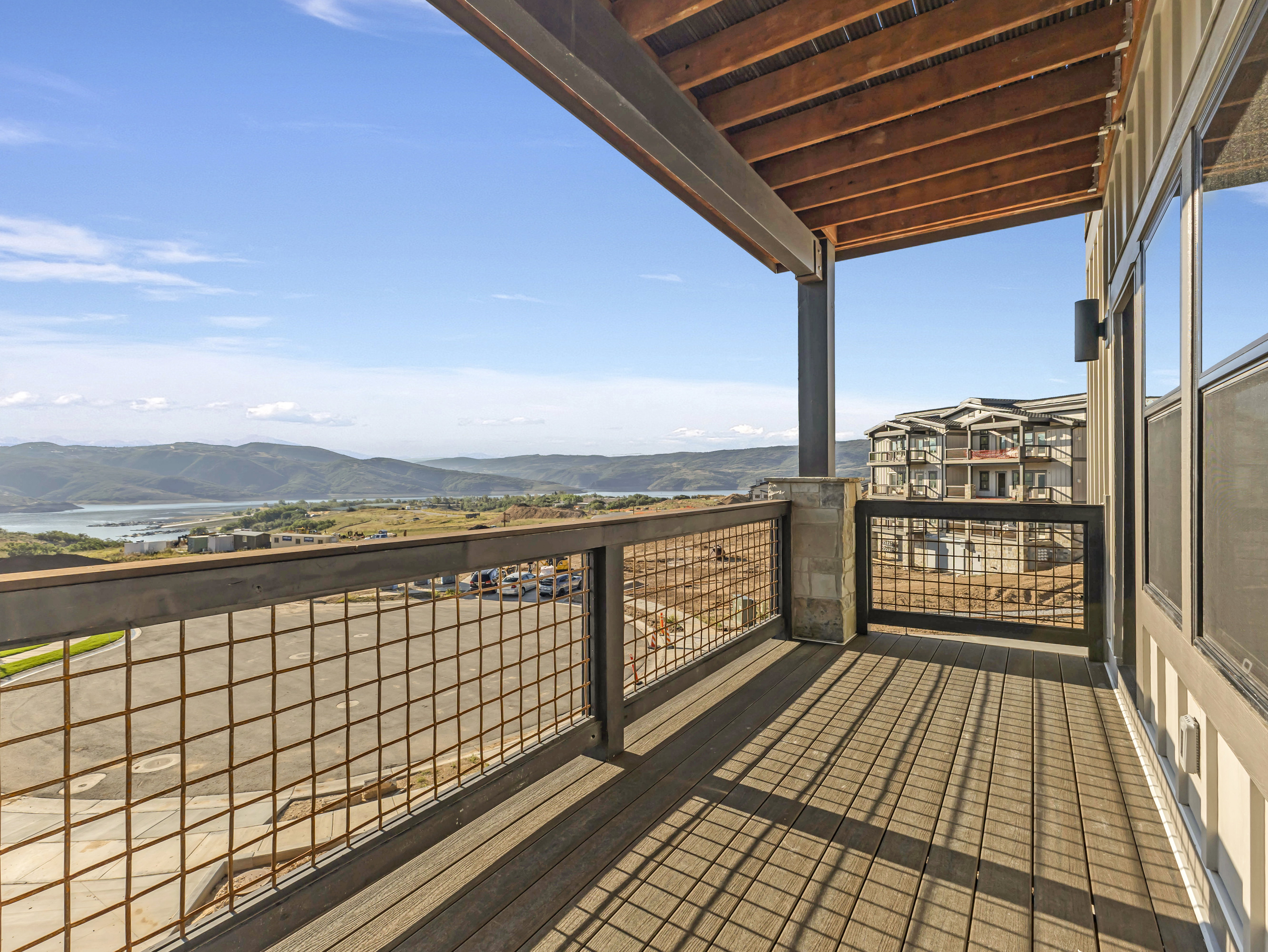 Covered outdoor deck with composite wood-finish flooring