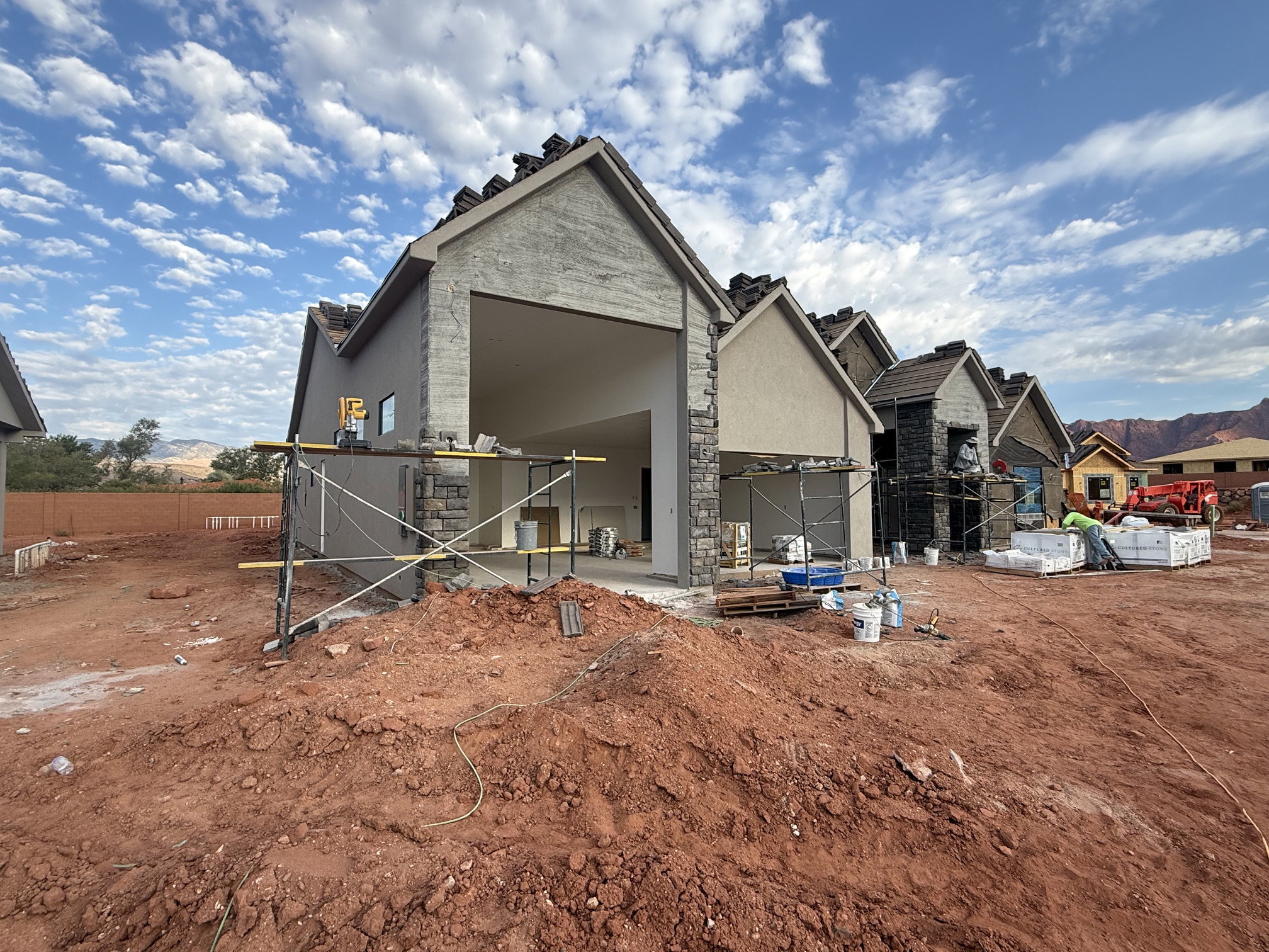 Contemporary architectural style with stucco and stone veneer exterior