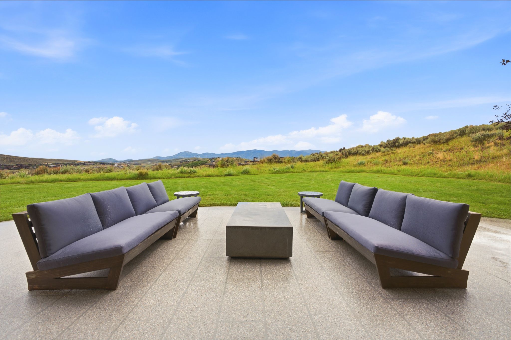 Expansive outdoor patio featuring light-colored tile flooring