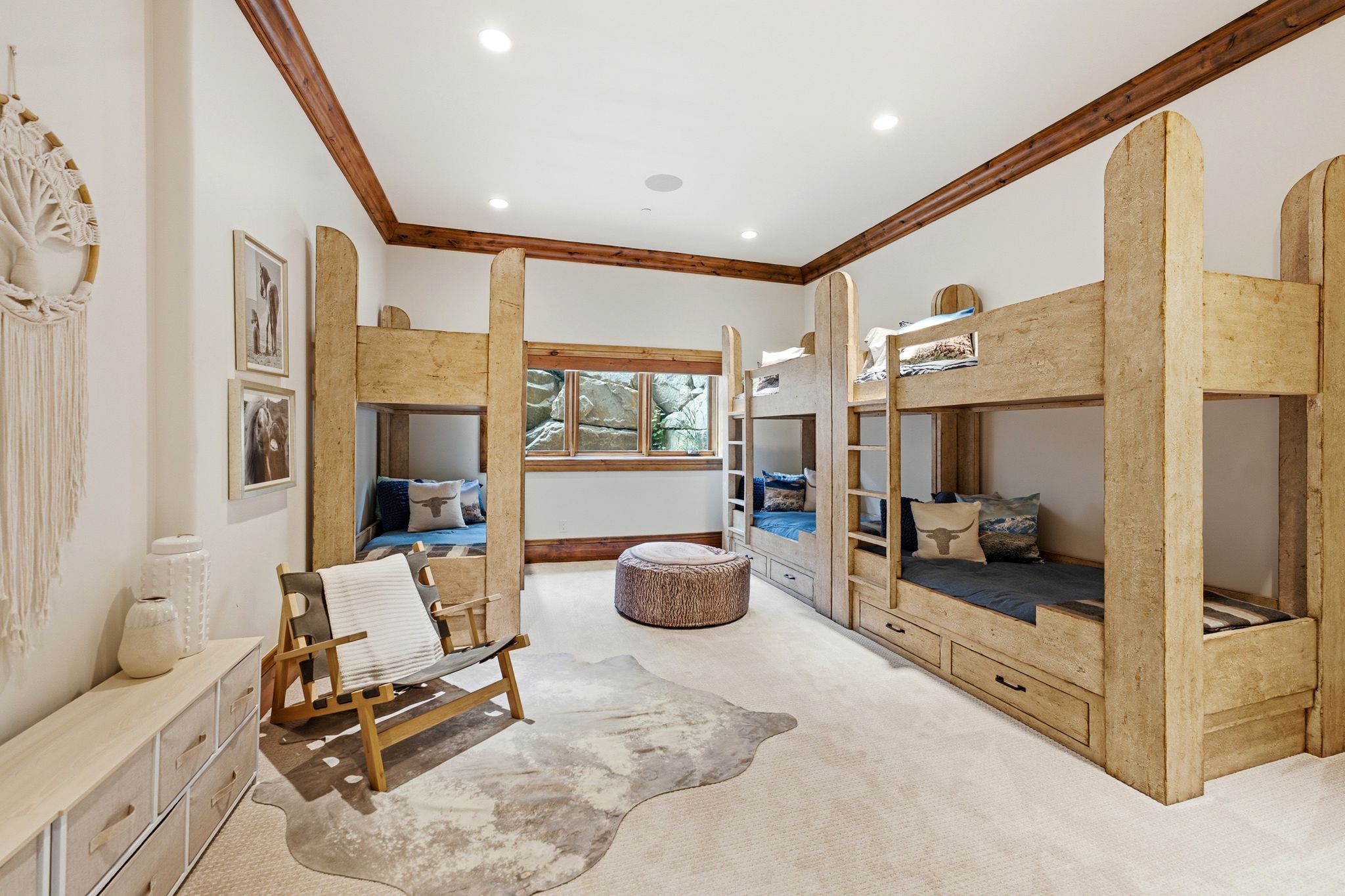 Room featuring two built-in bunk bed structures with integrated storage drawers