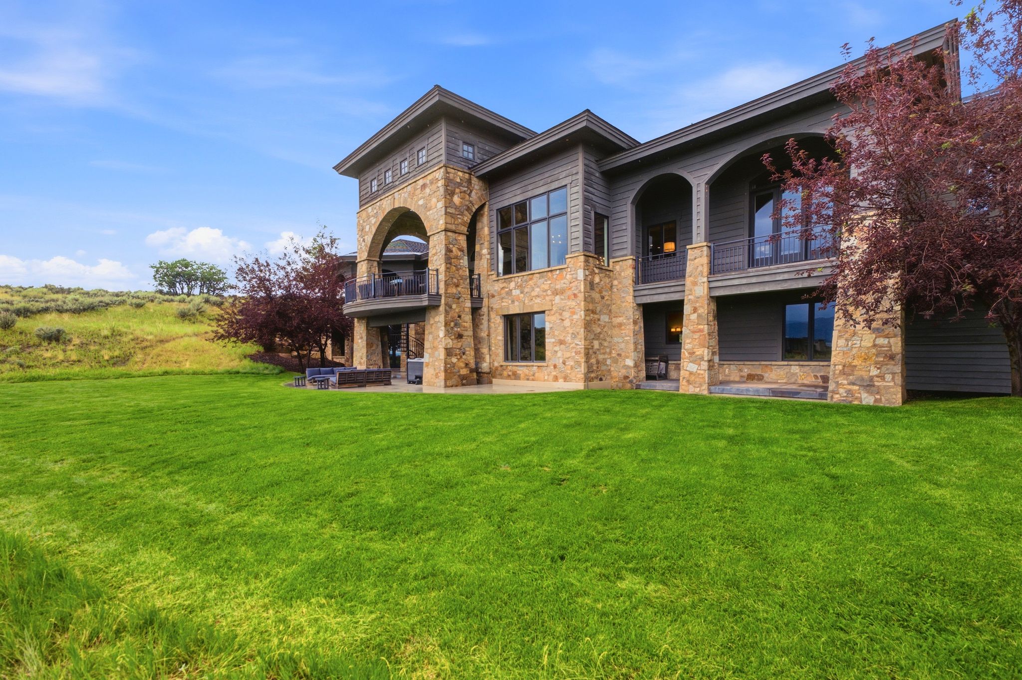 Contemporary exterior featuring a stone and siding facade