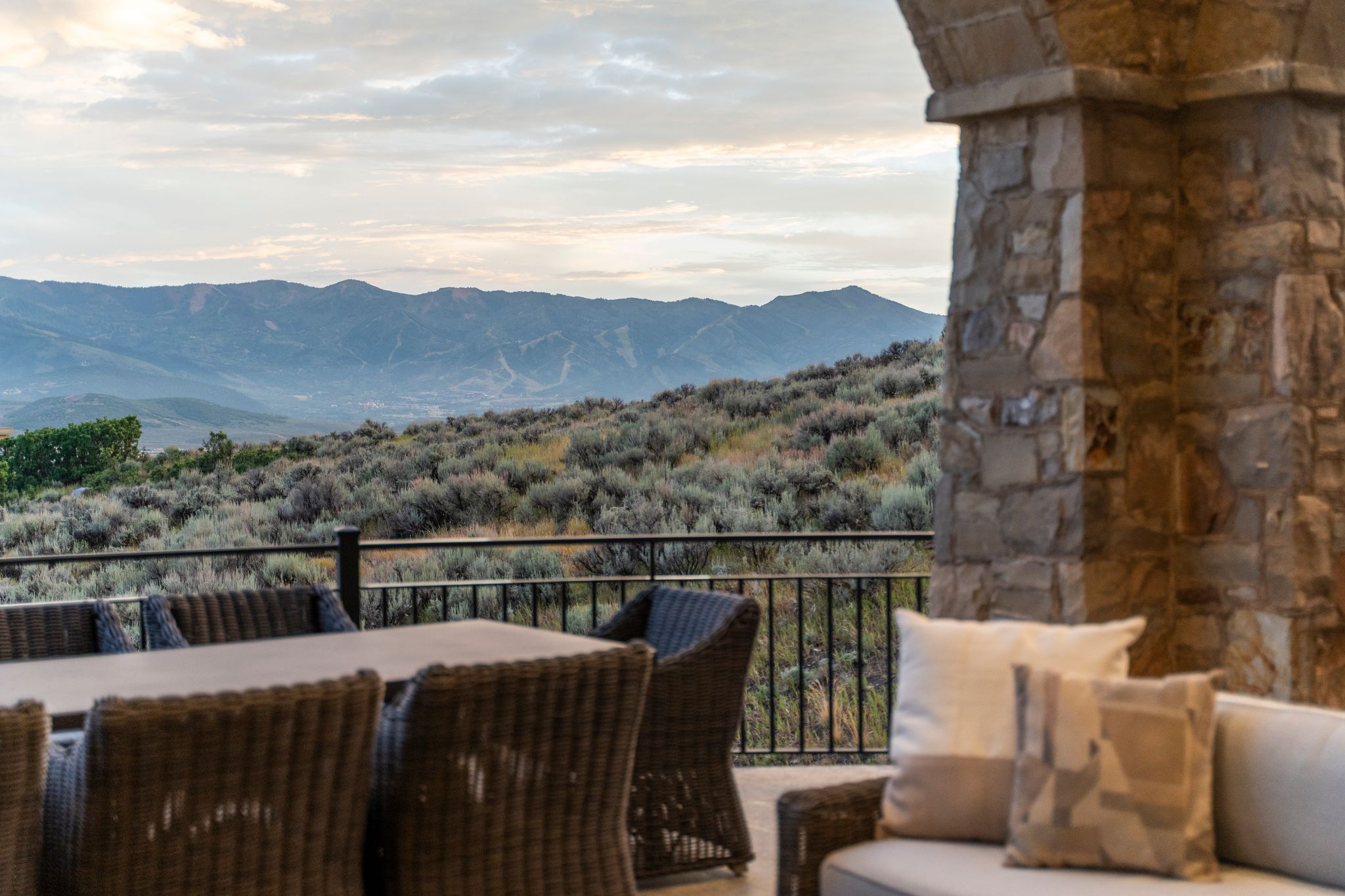 Outdoor living area featuring stone archway and column