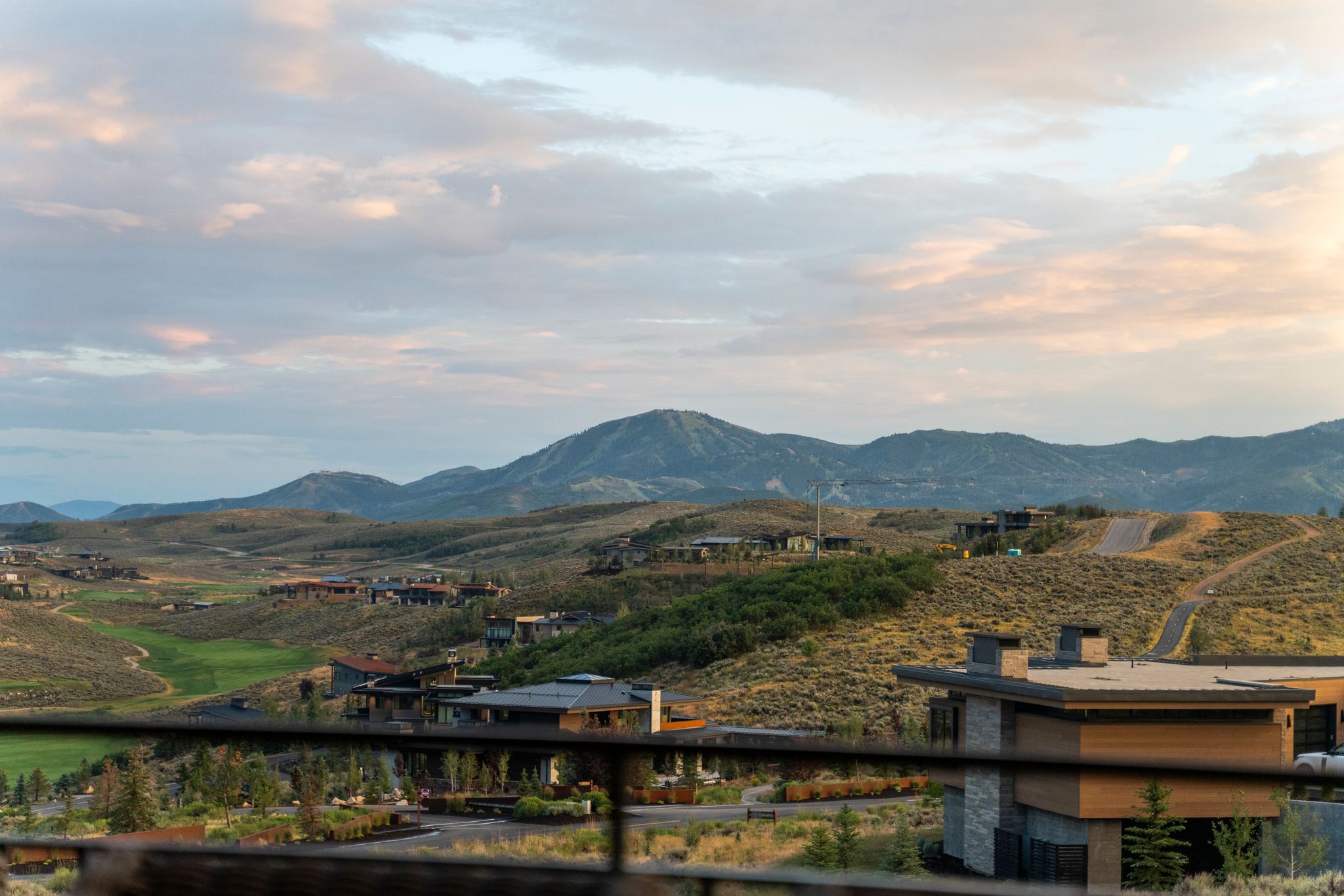 Expansive mountain landscape featuring distant peaks and rolling terrain