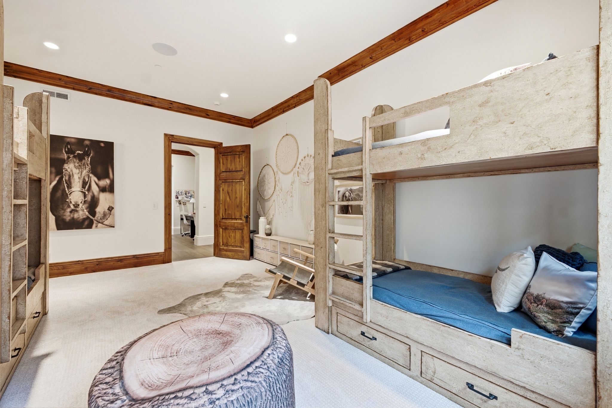 Bedroom featuring a built-in bunk bed system with integrated storage drawers