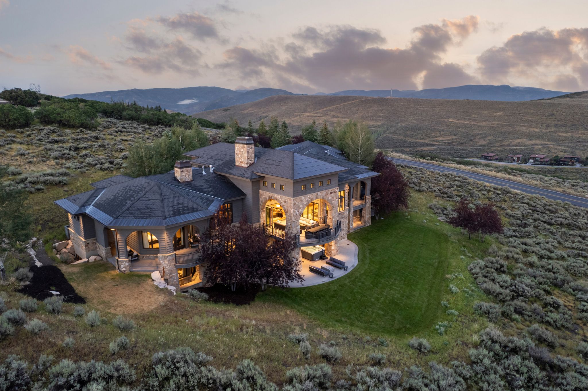 Expansive stone and stucco residence with multi-level outdoor living areas