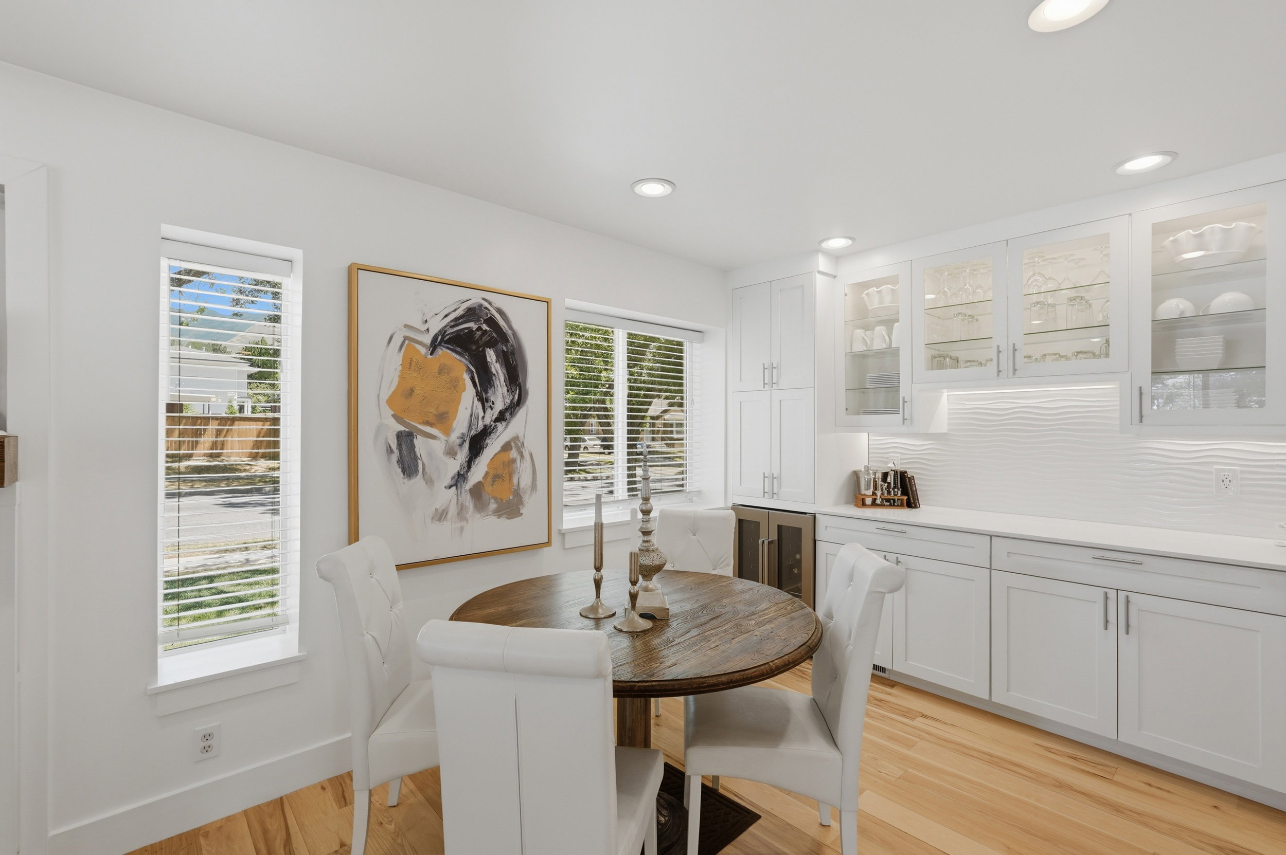 Dining area with light wood-finish flooring