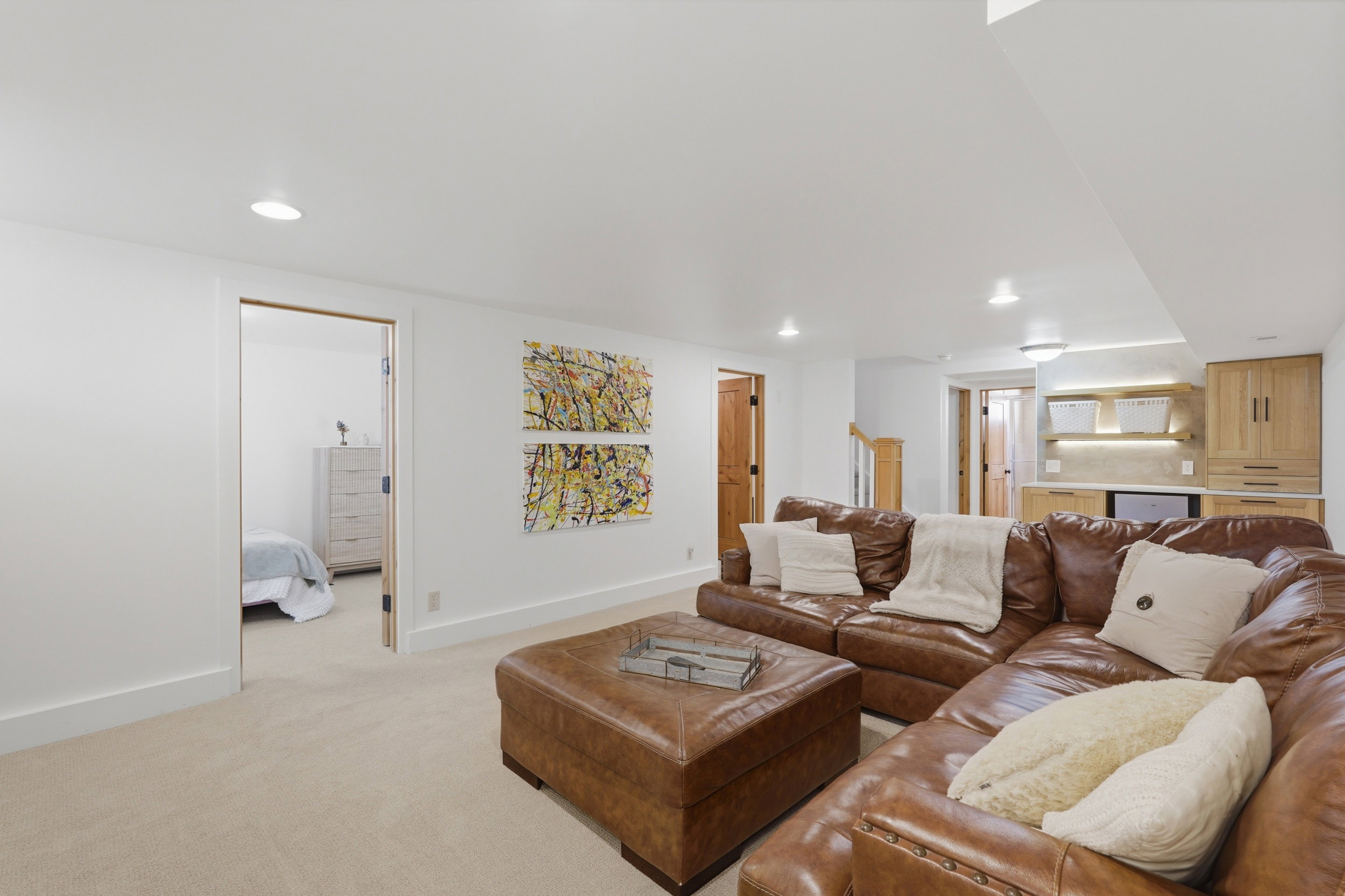 Spacious room featuring neutral carpeting and recessed lighting