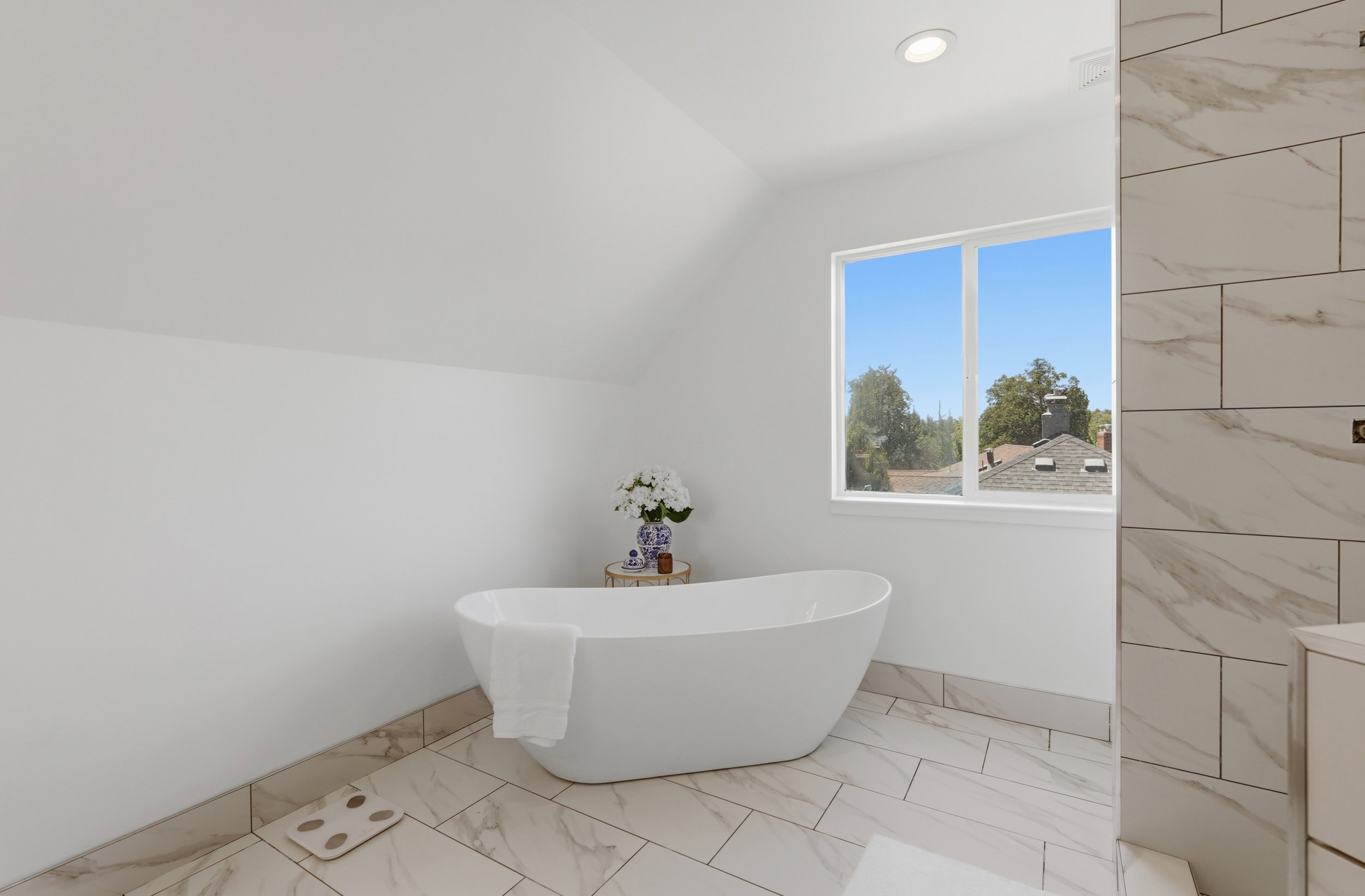 Owners ensuite. Freestanding soaking tub with a white finish