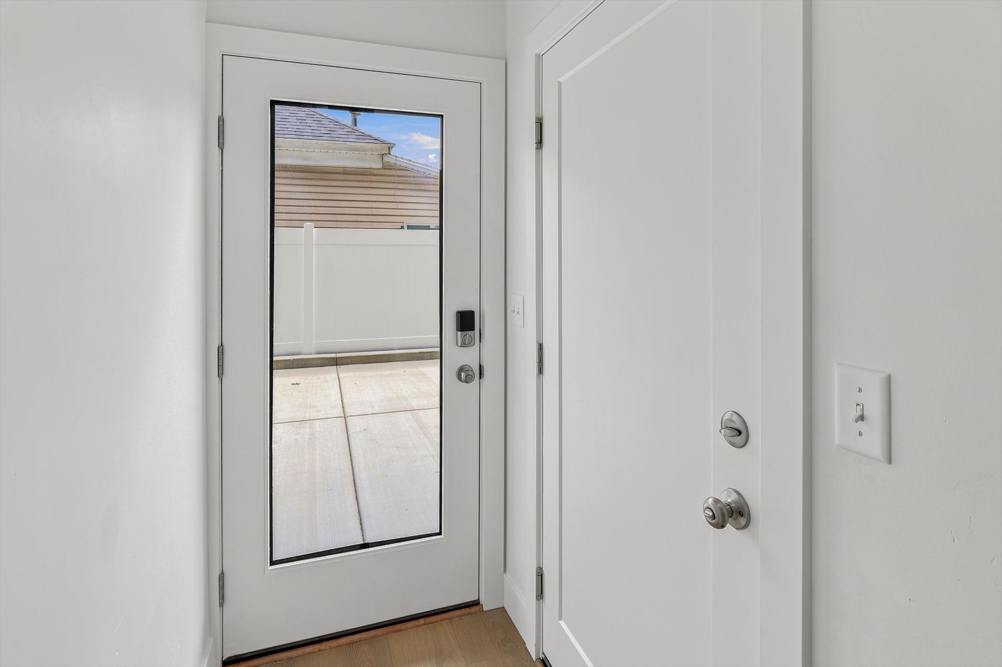 Full-light glass entry door with smart lock system